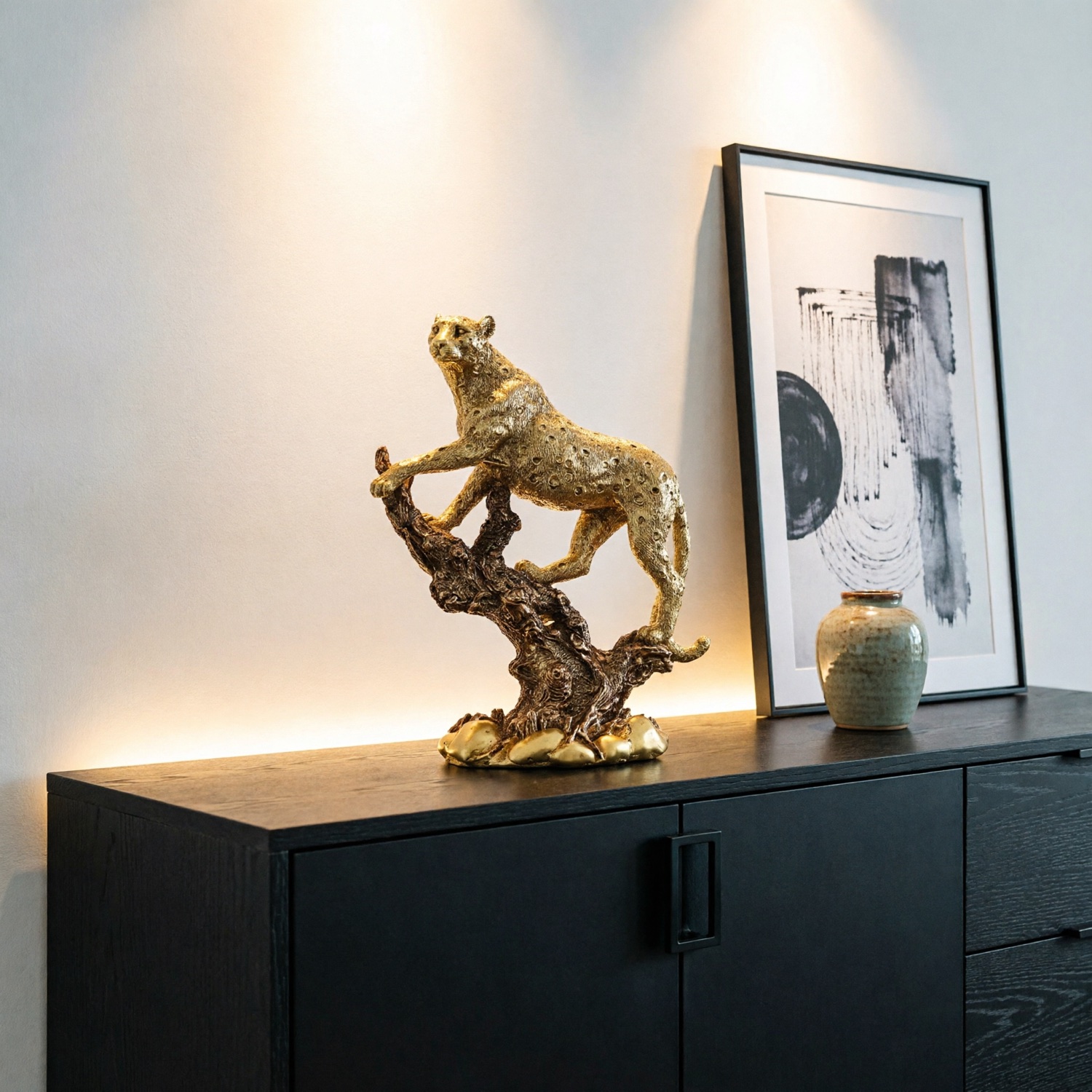 Gold leopard statue styled on a sideboard